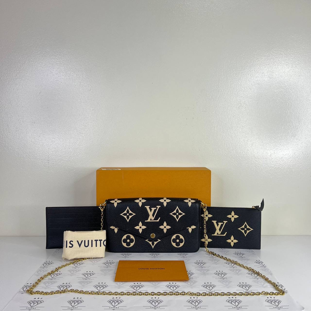 [PRE LOVED] Louis Vuitton Felicie in Black/Creme Bicolor Empreinte Leather (microchipped)