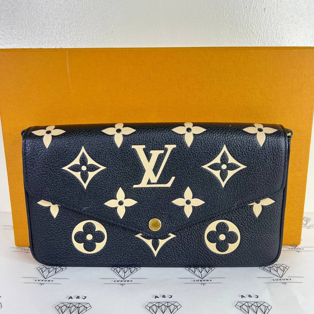 [PRE LOVED] Louis Vuitton Felicie in Black/Creme Bicolor Empreinte Leather (microchipped)