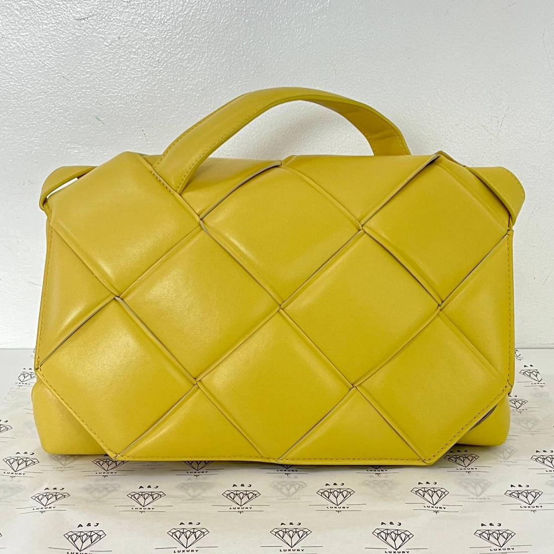 [PRE LOVED] Bottega Veneta Maxi Nappa Intrecciato Top Handle Bag in Yellow