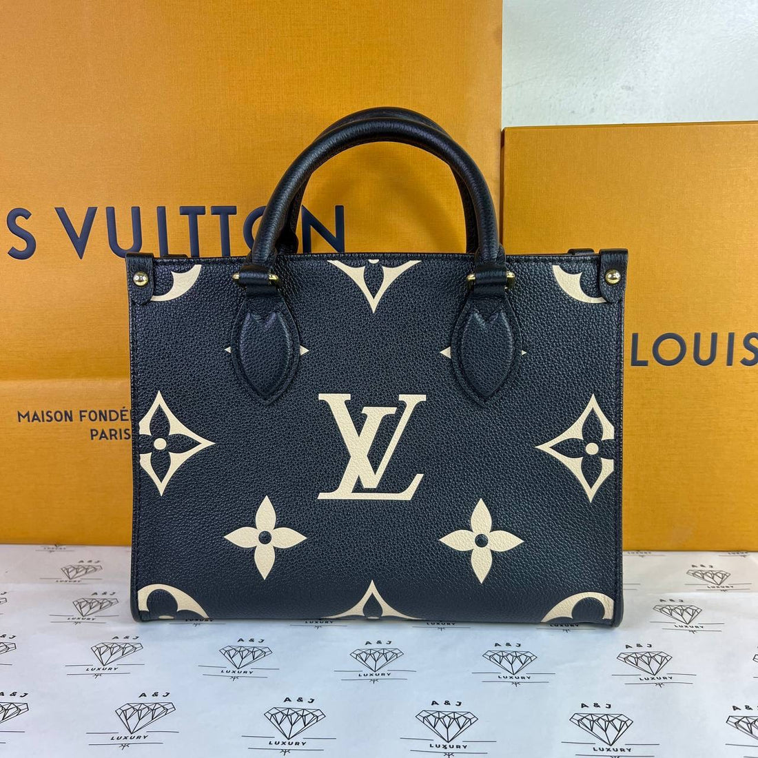 [PRE LOVED] Louis Vuitton OnTheGo PM in Black/Creme Bicolor Empreinte Leather (microchipped)