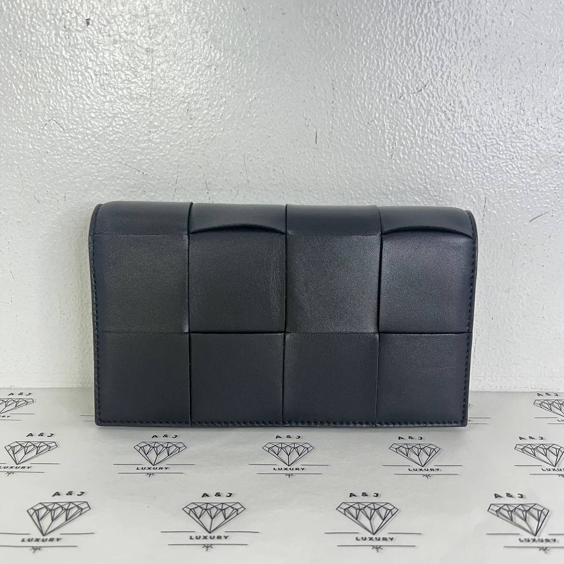[PRE LOVED] Bottega Veneta Cassette Wallet on Strap in Black GHW