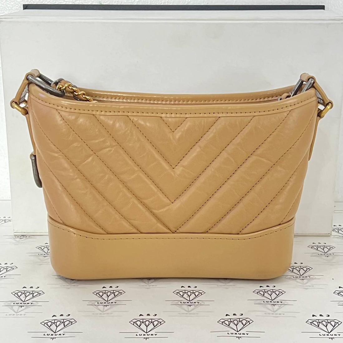 [PRE LOVED] Chanel Small Gabrielle in Beige Chevron Lambskin Leather Gold/Silver/Ruthenium Hardware (Series 28)