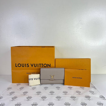 [PRE LOVED] Louis Vuitton Capucines Compact Wallet in Galet Taurillon Leather (microchipped)