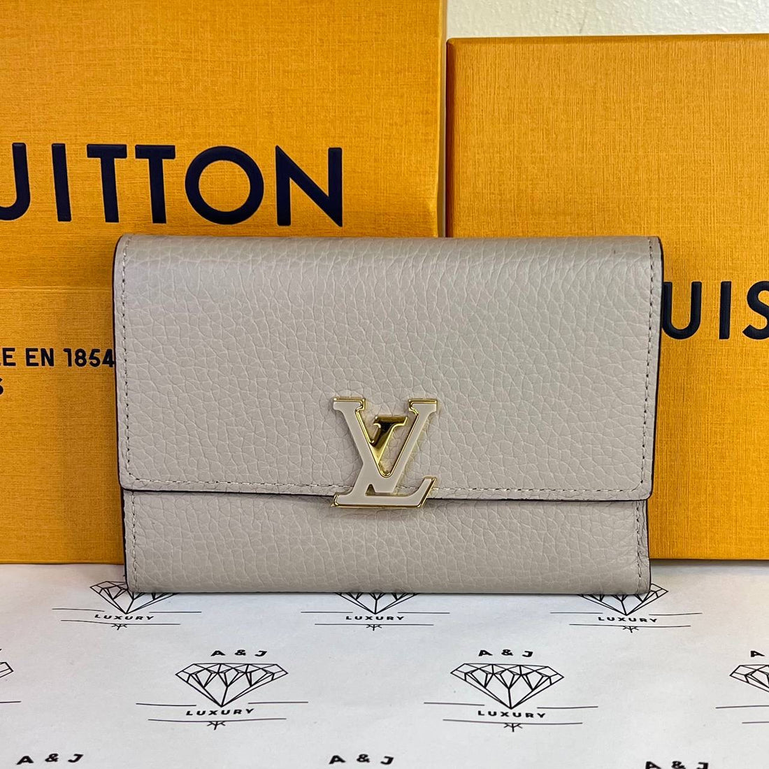 [PRE LOVED] Louis Vuitton Capucines Compact Wallet in Galet Taurillon Leather (microchipped)