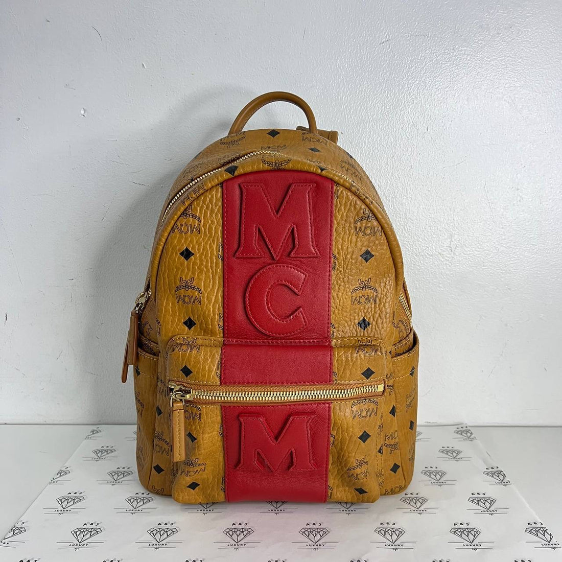 [PRE LOVED] MCM Stark Logo Stripe Backpack in Cognac Visetos Leather GHW