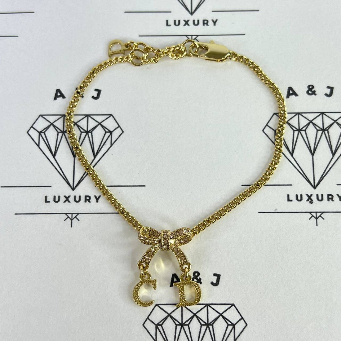 [PRE LOVED] Christian Dior Logo Bow Bracelet in Gold