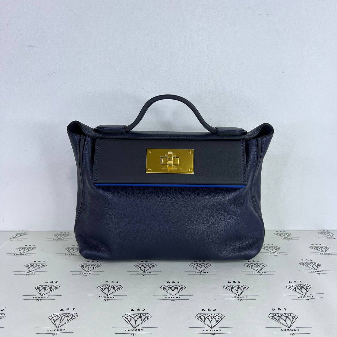 [PRE LOVED] Hermes Mini 24/24 in Bleu Nuit Evercolor Leather GHW (Stamp B - 2023)