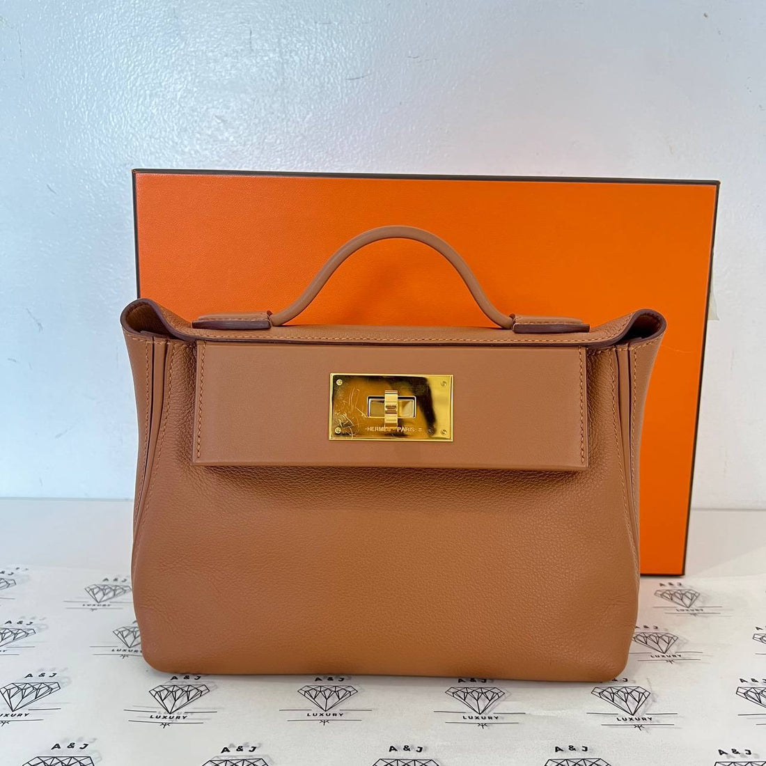 [PRE LOVED] Hermes Mini 24/24 in Toffee Evercolor Leather GHW (Stamp U - 2022)