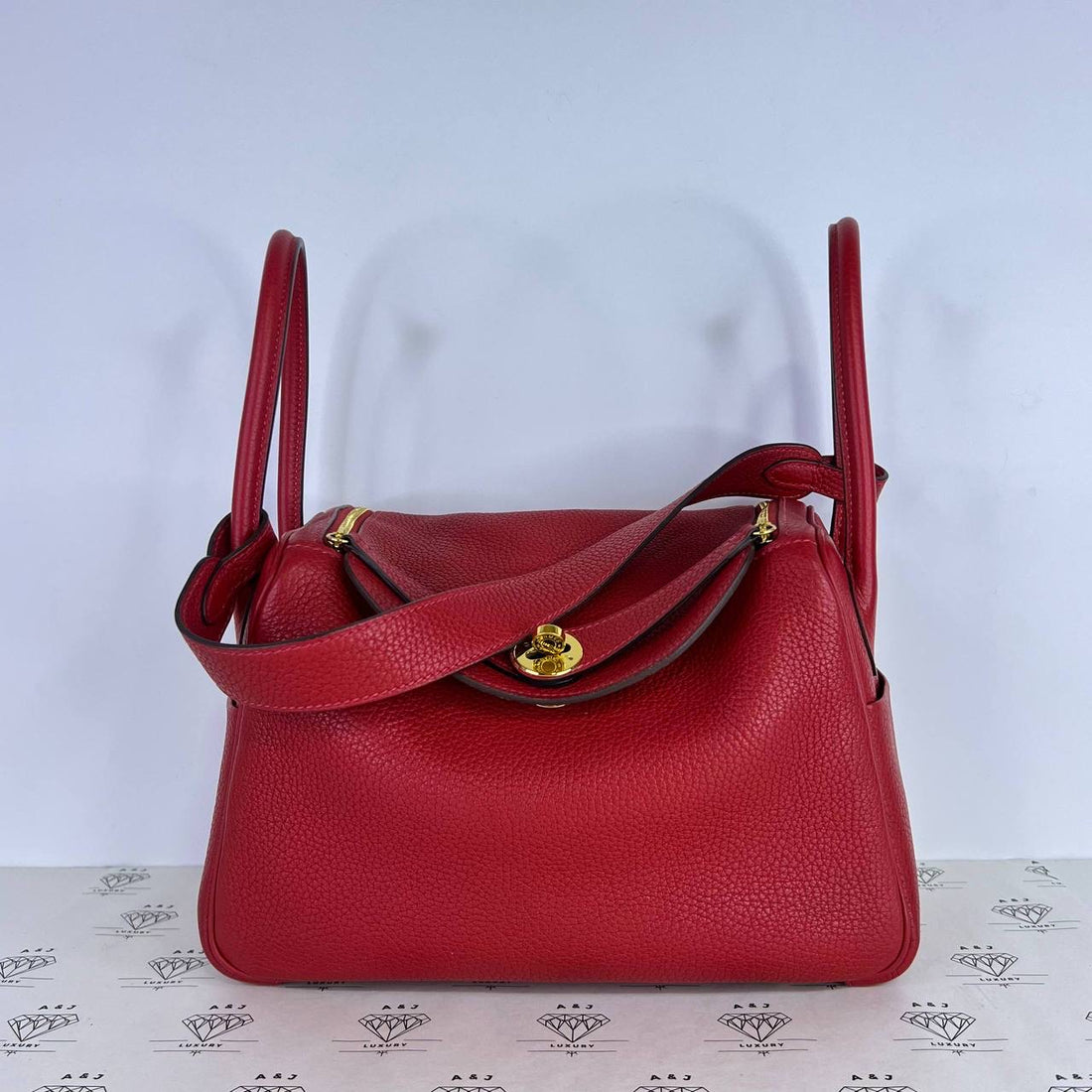 [PRE LOVED] Hermes Lindy 26 in Rouge Casaque Clemence Leather GHW (Stamp T - 2015