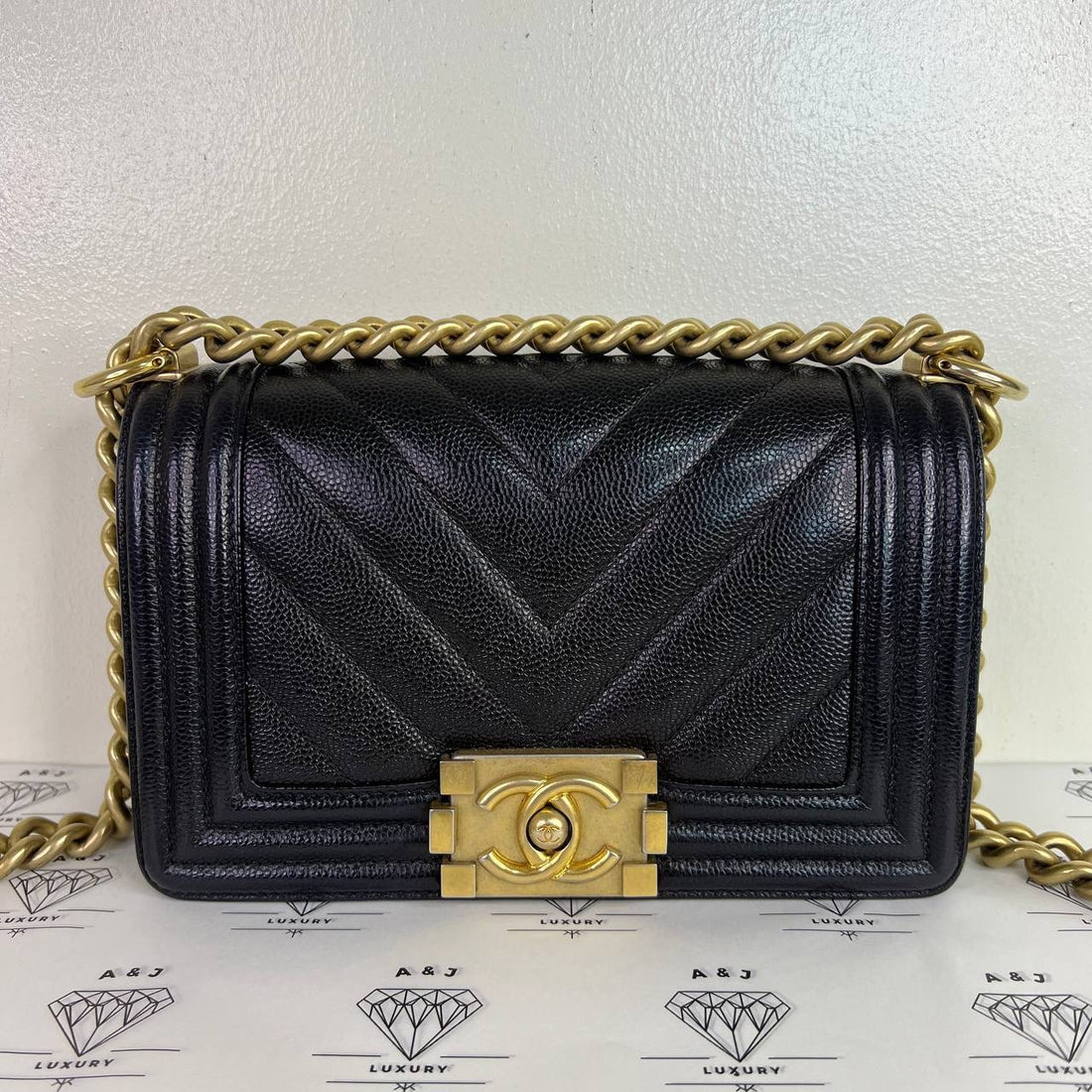 [PRE LOVED] Chanel Small Leboy Chevron in Black Caviar Aged Gold HW (Series 24)
