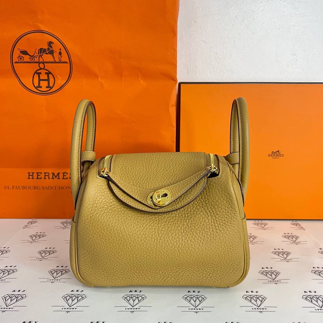 [PRE LOVED] Hermes Mini Lindy in Biscuit Clemence Leather GHW (Stamp U - 2022)