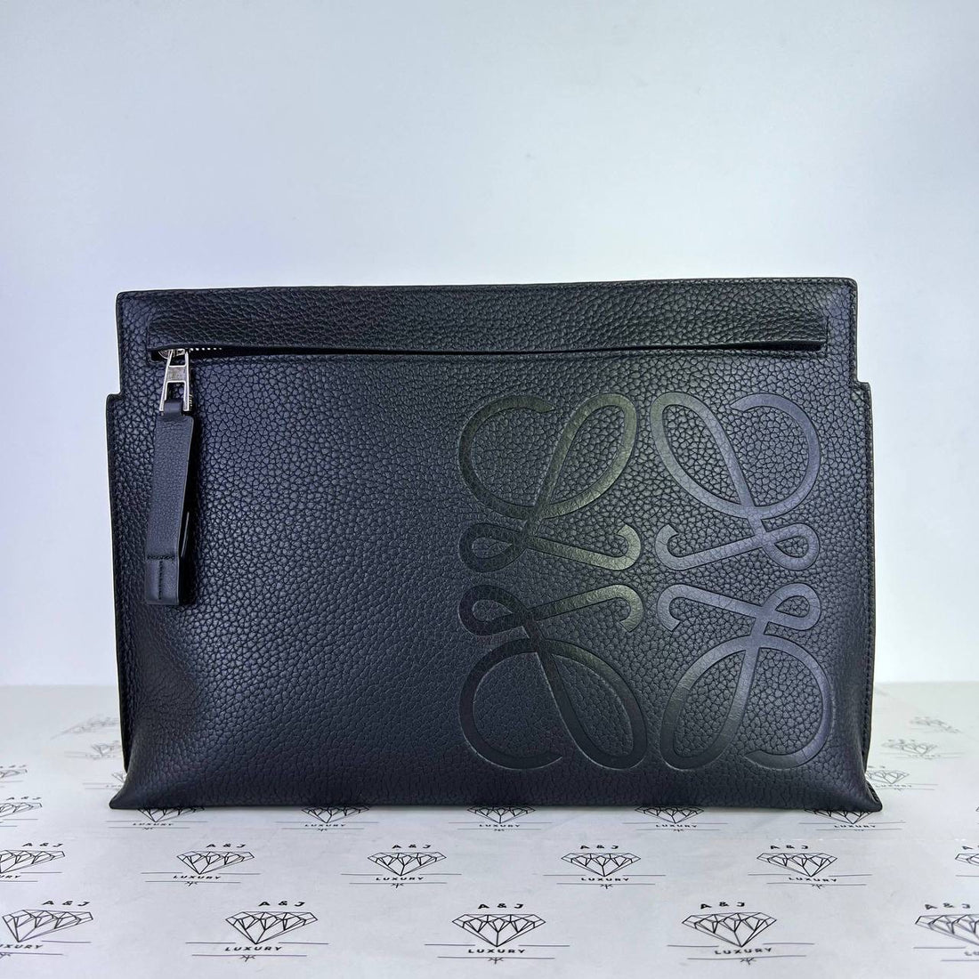 [PRE LOVED] Loewe Anagram Clutch in Black Grained Leather SHW