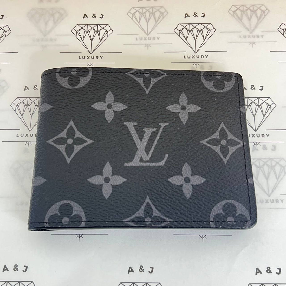 [PRE LOVED] Louis Vuitton Multiple Wallet in Monogram Eclipse (microchipped)