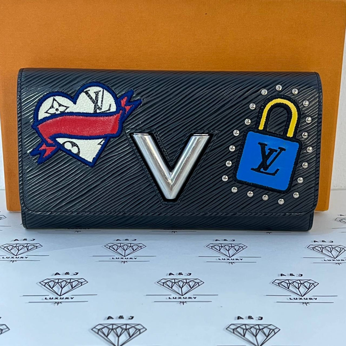 [PRE LOVED] Louis Vuitton Twist Wallet with travel patches in Black Epi Leather SHW (TN3178)