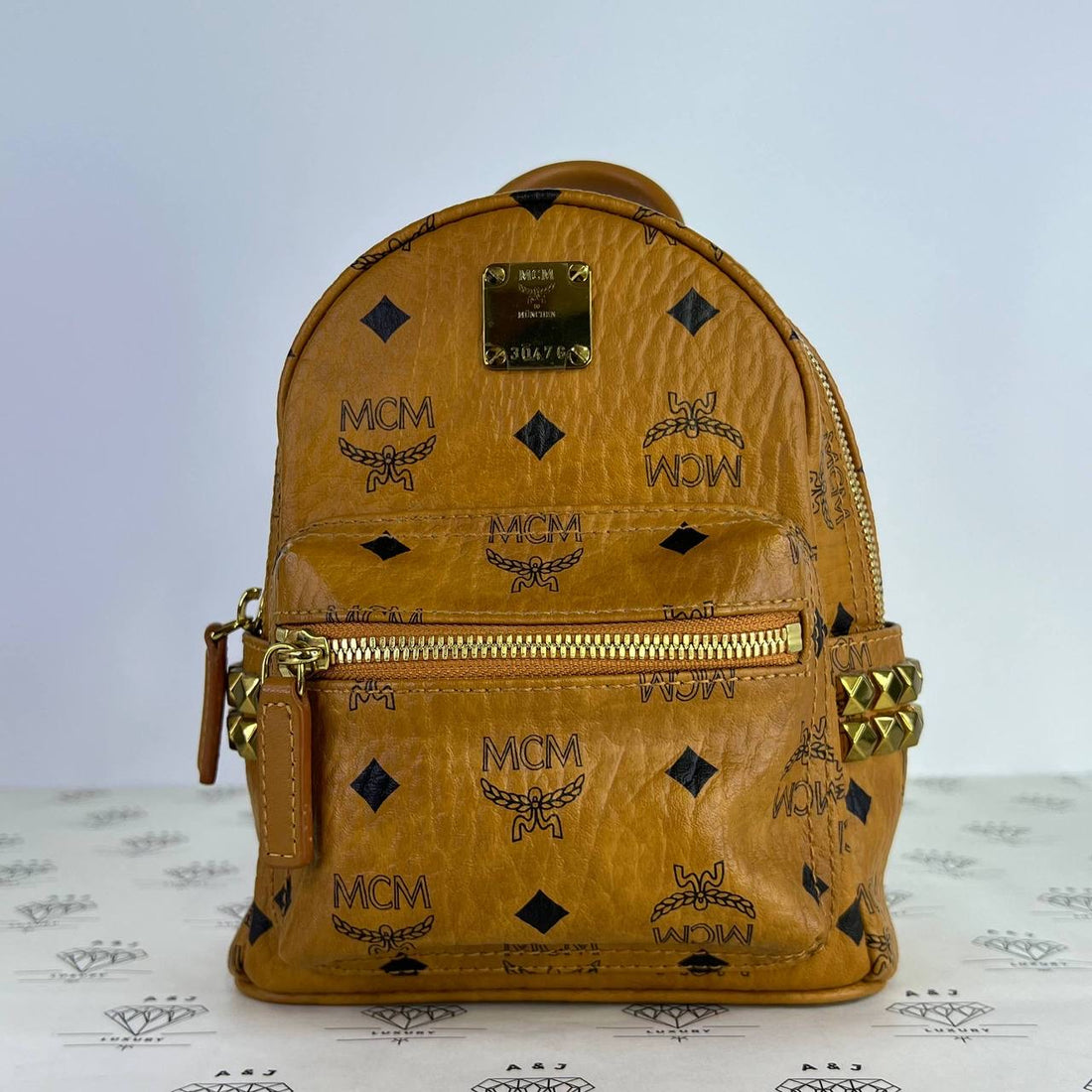 [PRE LOVED] MCM Mini Stark Backpack in Cognac GHW