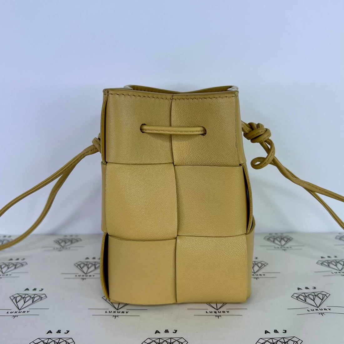 [PRE LOVED] Bottega Veneta Mini Cassette Bucket Bag in Beige