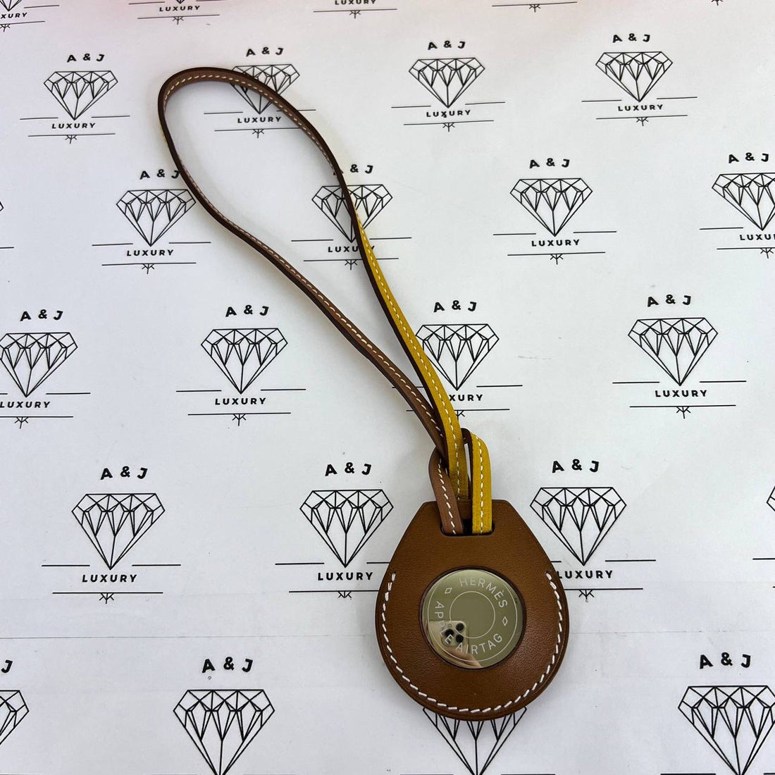 [PRE LOVED] Hermes Airtag Bag Charm in Gold