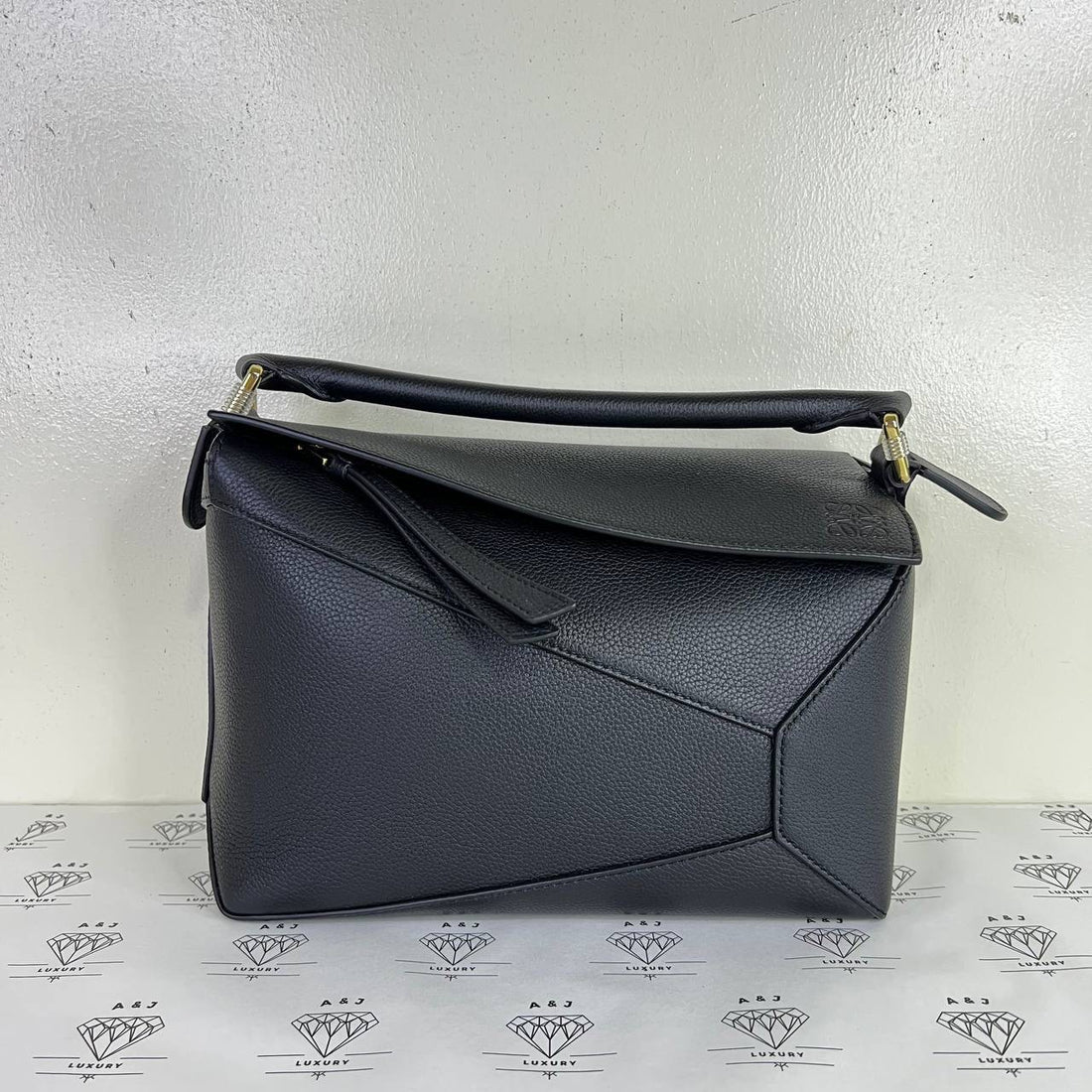 [PRE LOVED] Loewe Small Puzzle Edge in Black Grained Calfskin Leather GHW