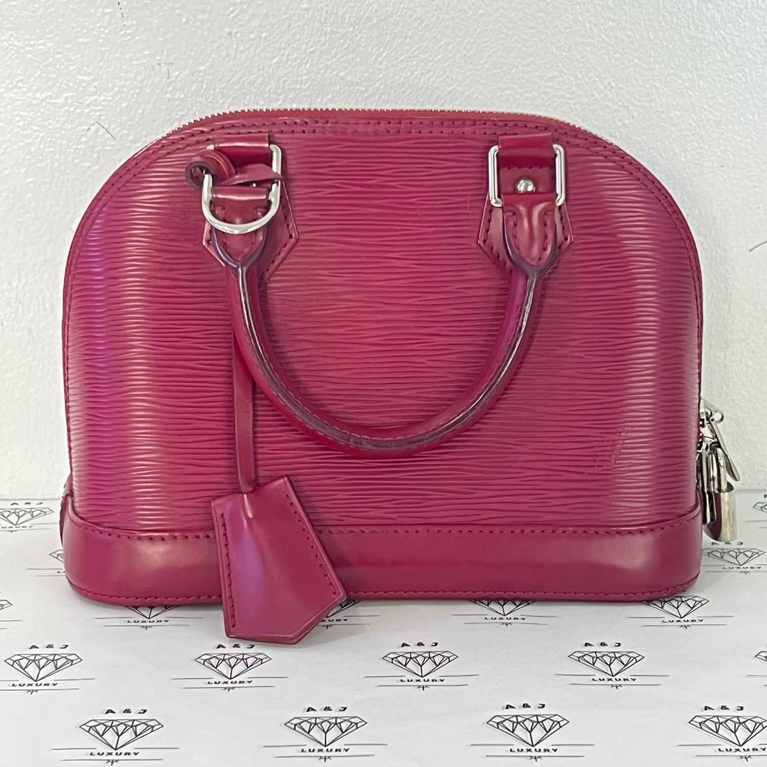 [PRE LOVED] Louis Vuitton Alma BB in Fuchsia Epi Leather SHW (FL0135)