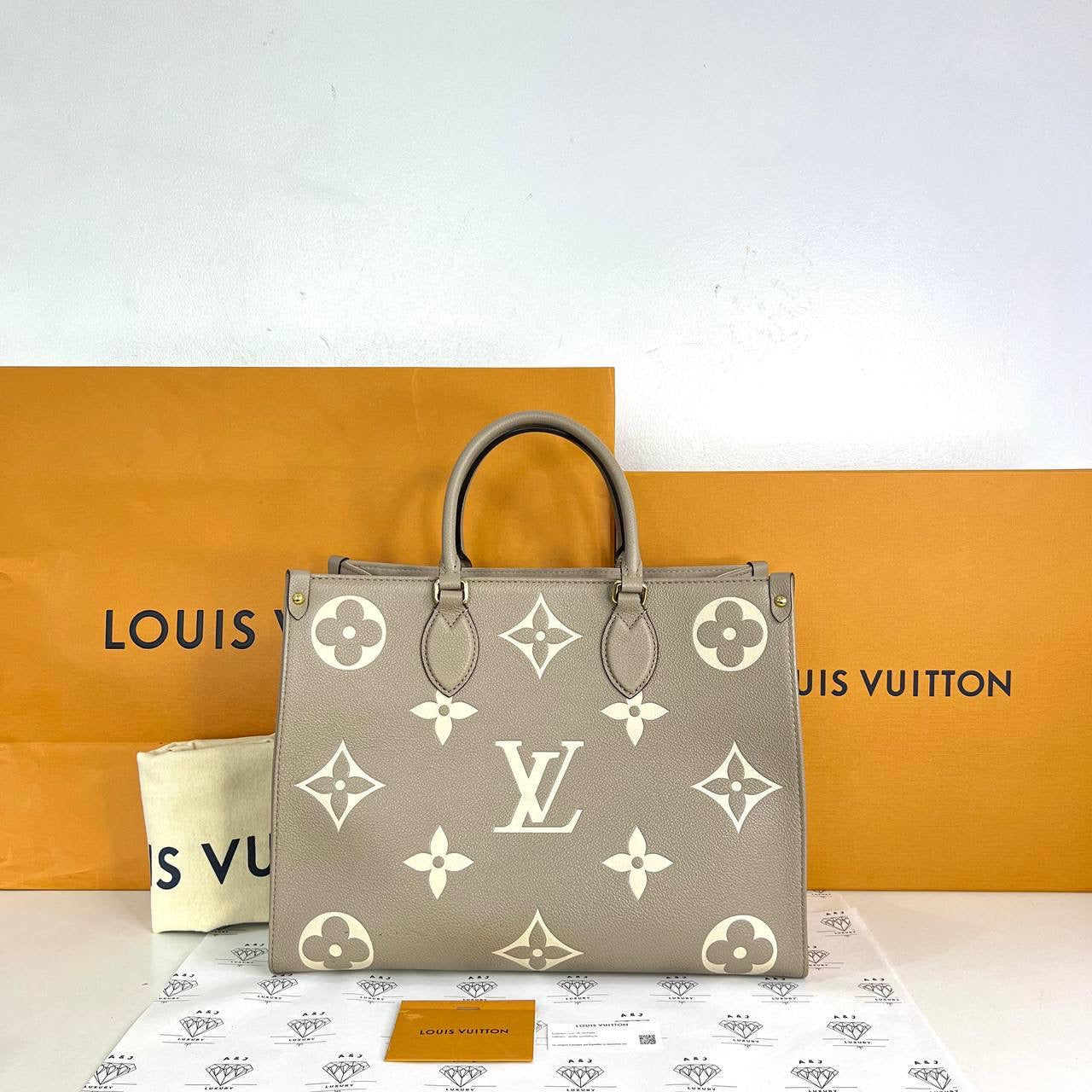 [PRE LOVED] Louis Vuitton OnTheGo MM in Tourtelle Bicolor Empreinte Leather (microchipped)