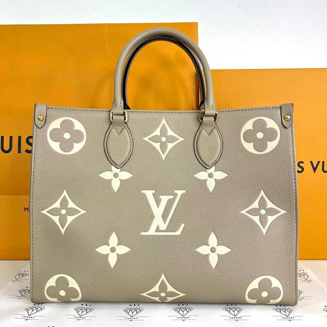 [PRE LOVED] Louis Vuitton OnTheGo MM in Tourtelle Bicolor Empreinte Leather (microchipped)