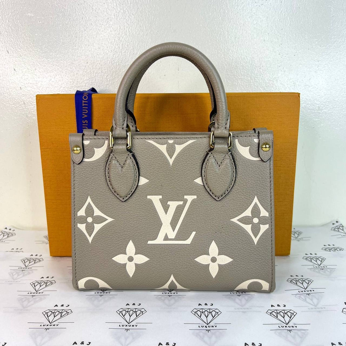[PRE LOVED] Louis Vuitton OnTheGo BB in Tourtelle/Creme Bicolor Empreinte Leather GHW (microchipped)