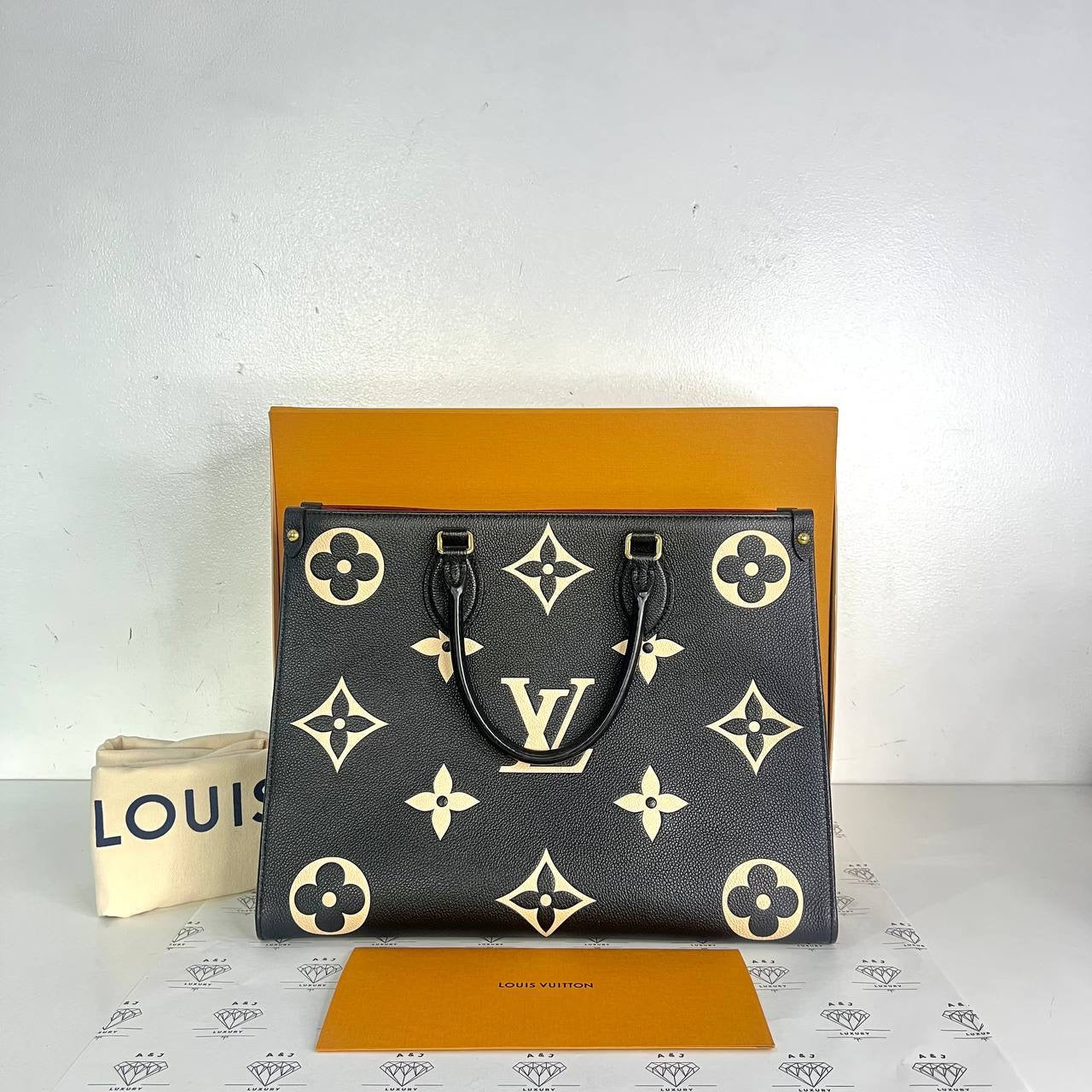 [PRE LOVED] Louis Vuitton OnTheGo MM in Black/Creme Bicolor Empreinte Leather (microchipped)