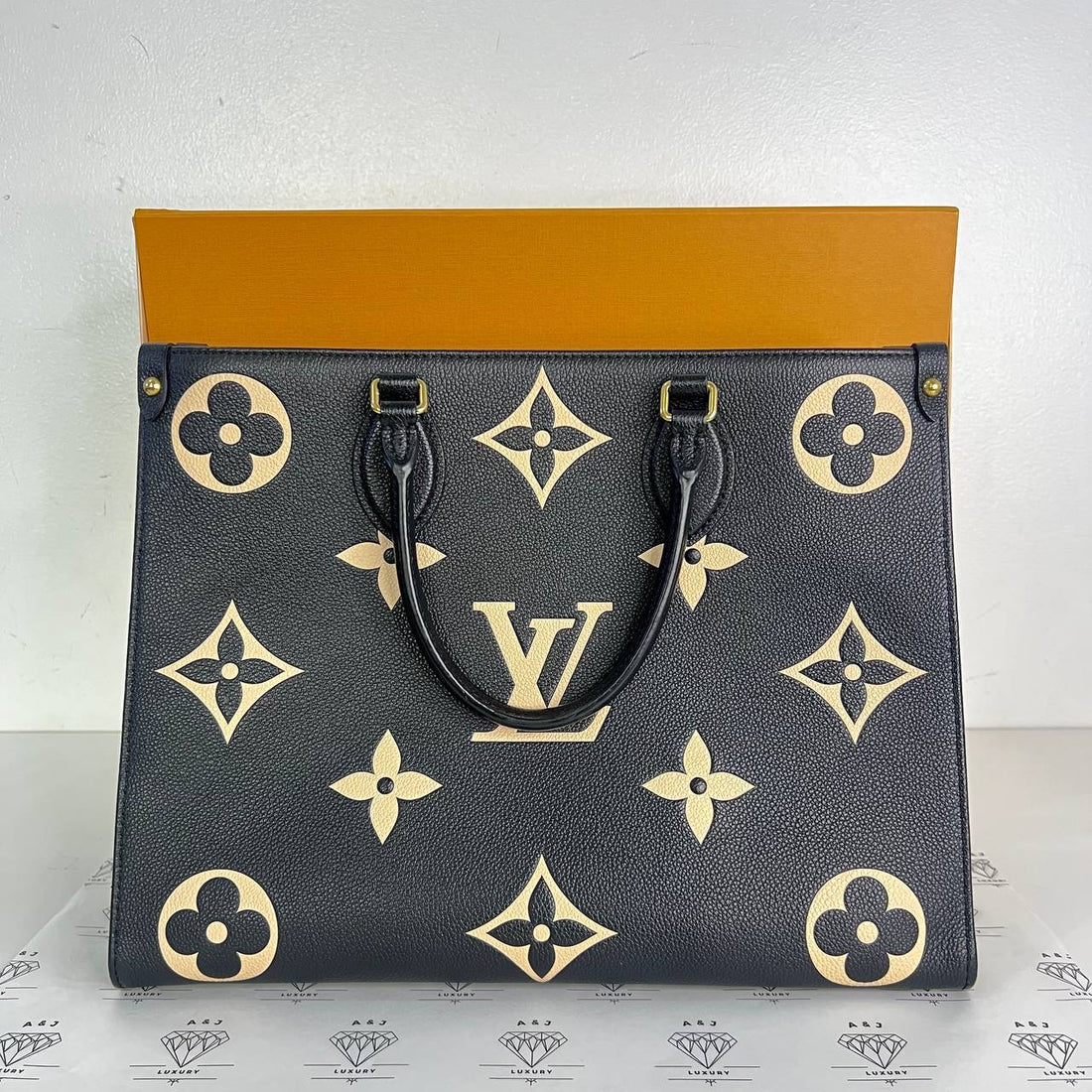 [PRE LOVED] Louis Vuitton OnTheGo MM in Black/Creme Bicolor Empreinte Leather (microchipped)