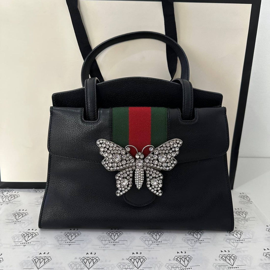 [PRE LOVED] Gucci Top Handle Bag in Crystal Butterfly Black Grained Leather with Web Strap Medium size